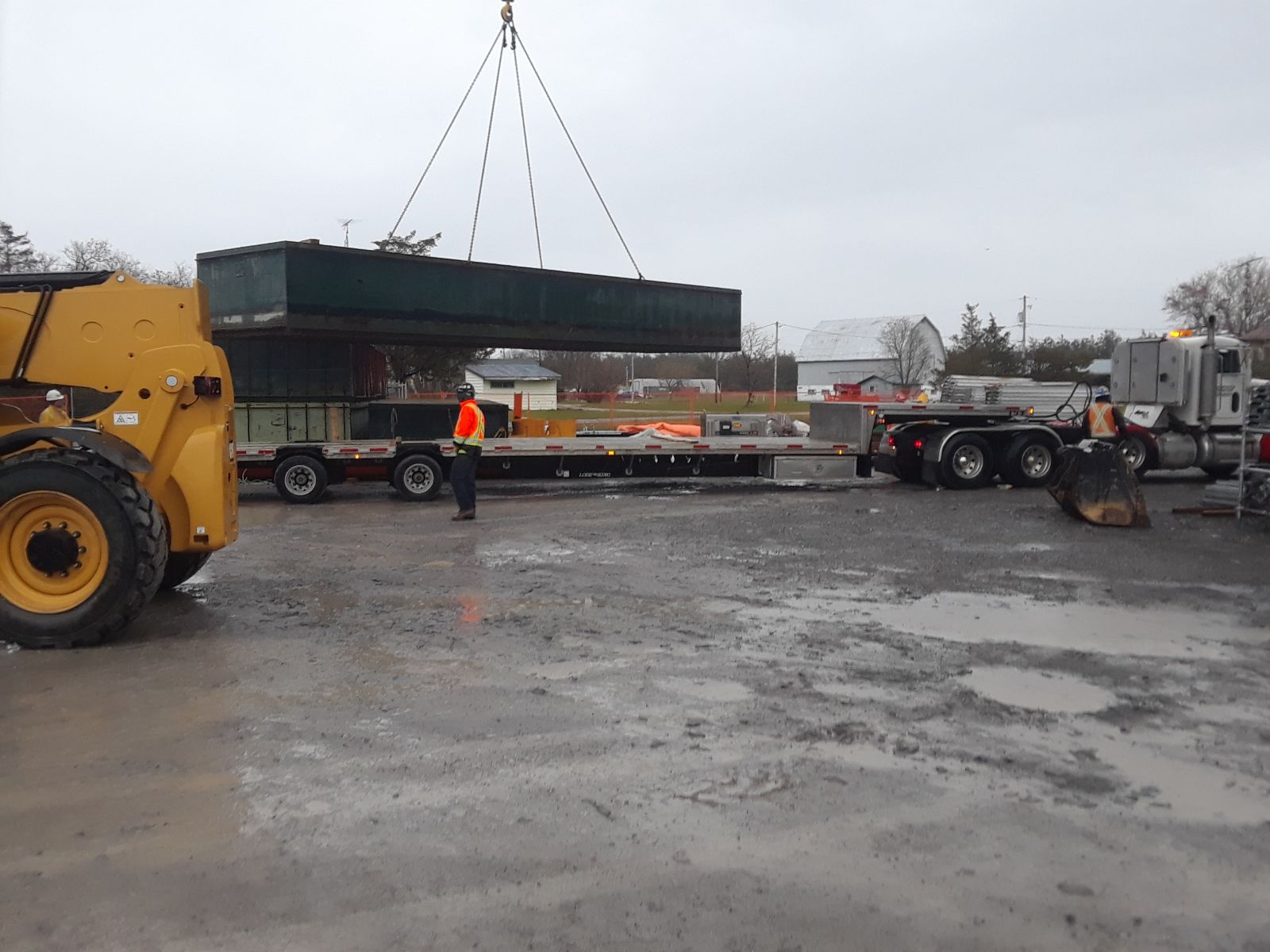 Barge section being lifted to the truck for removal from site