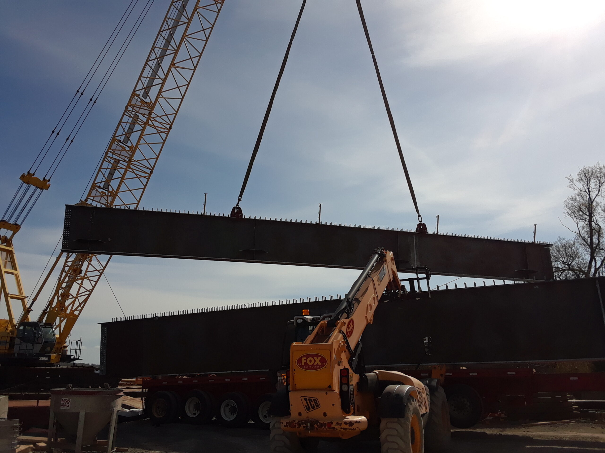First pieces of approach girder being offloaded from the truck