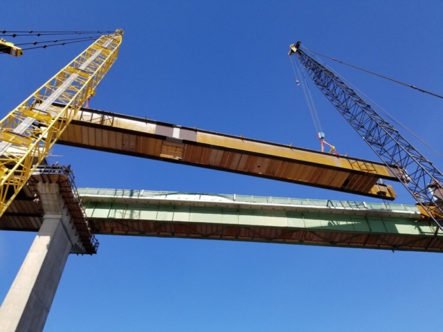 Approach girder being lowered into place