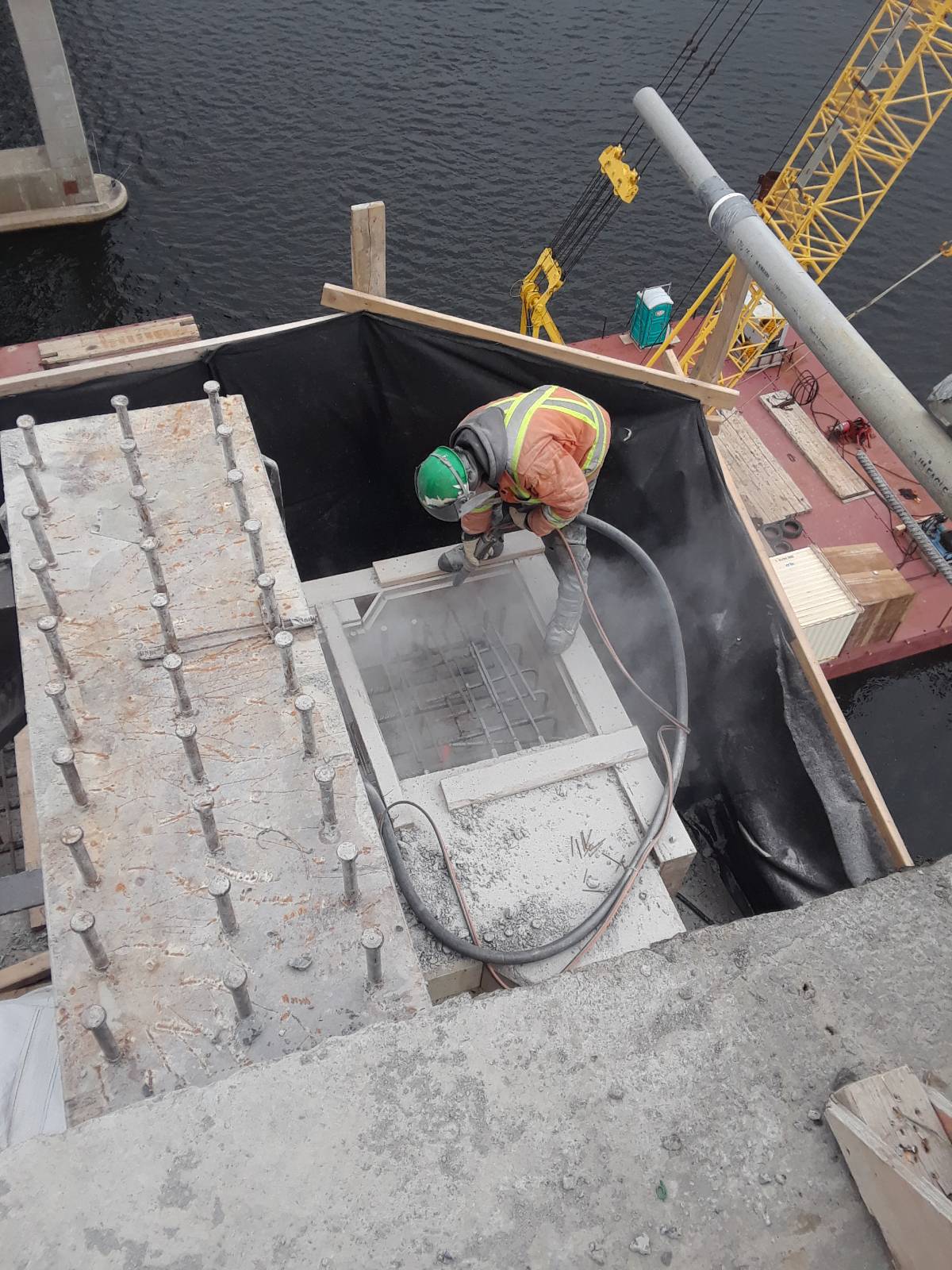 Cleaning the pier top in preparation for concrete placement