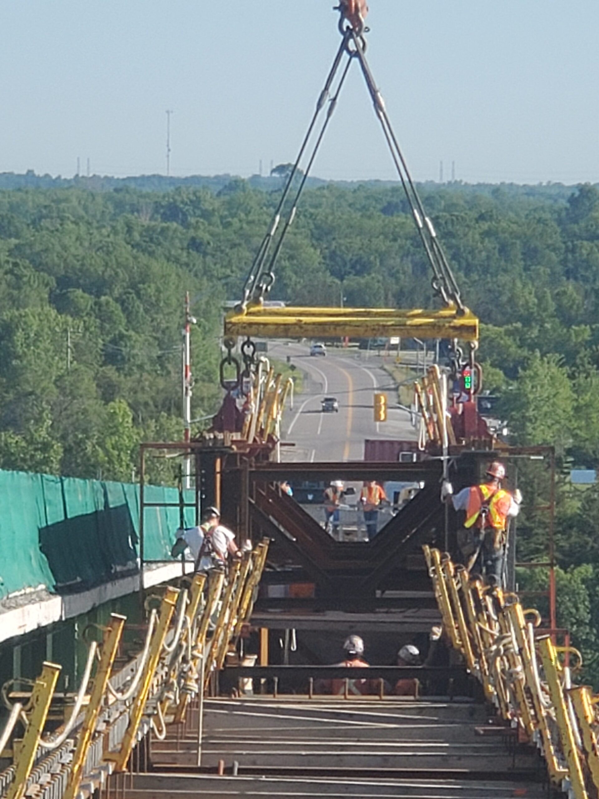 Deck view of the drop-in girder being lowered into place