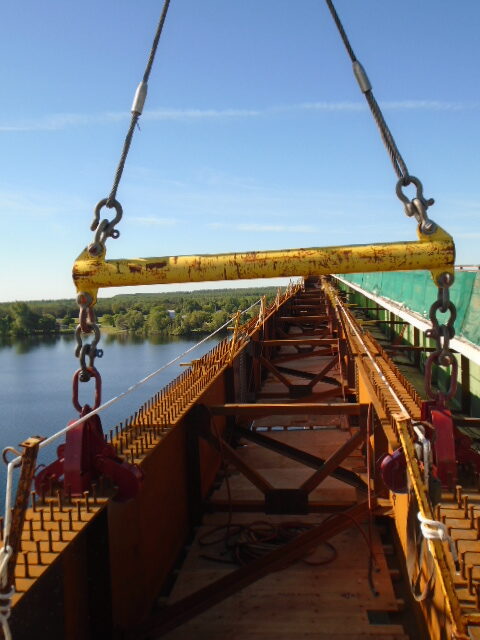 Girder being lifted for bearing work / spreader bar and Crosby clamps