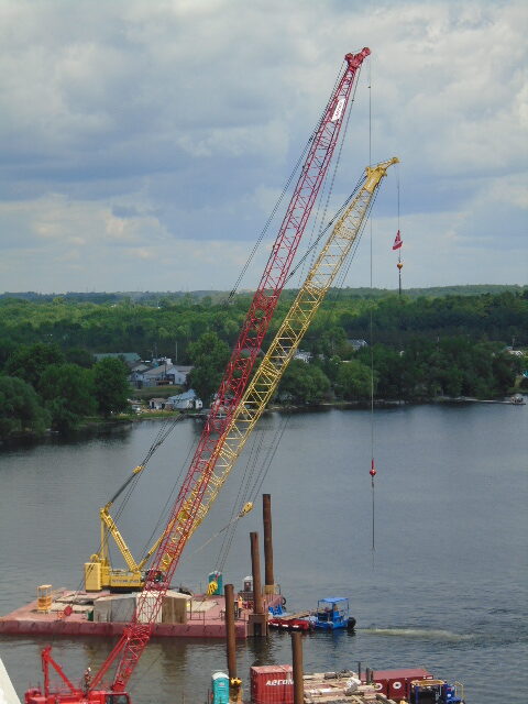 Crane and barge being moved