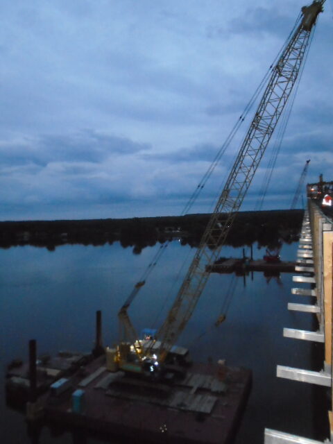 Early morning, setting up the cranes for concrete deck placement