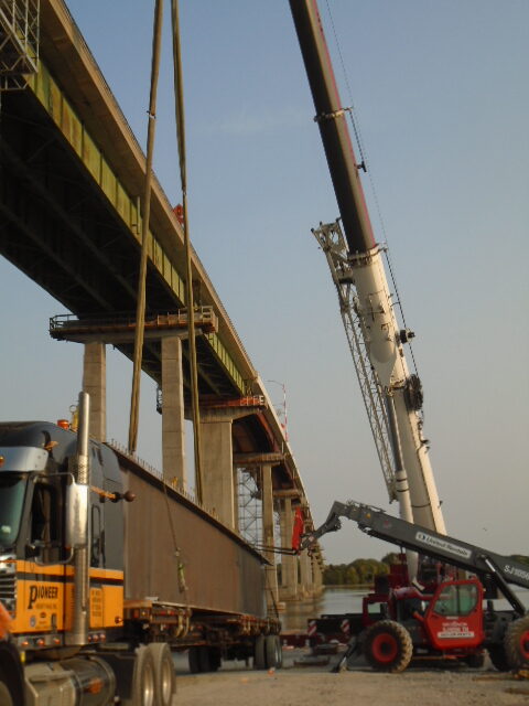 Preparing to remove the second approach girder from the truck