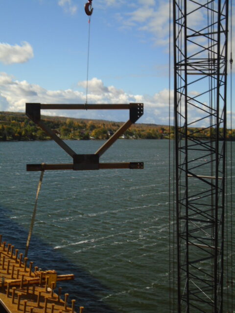 Lifting the "K" bracket to the installed girders for installation