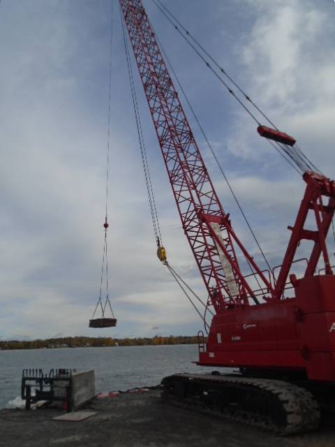 110 ton crane ready to load wood onto the boat