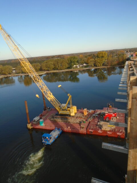 Moving both barges into place for more bracket installation