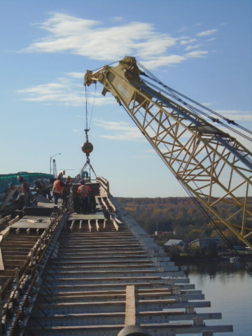 200 ton crane lowering formwork to the deck