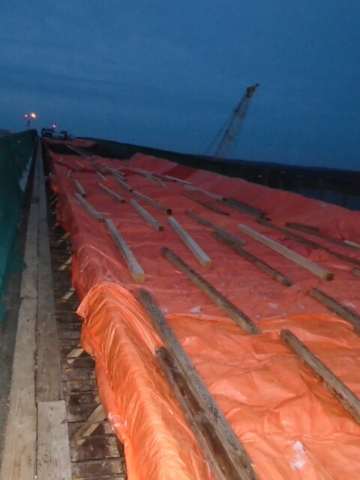 Looking south over the deck formwork covered with tarps to keep the heat in for concrete placement