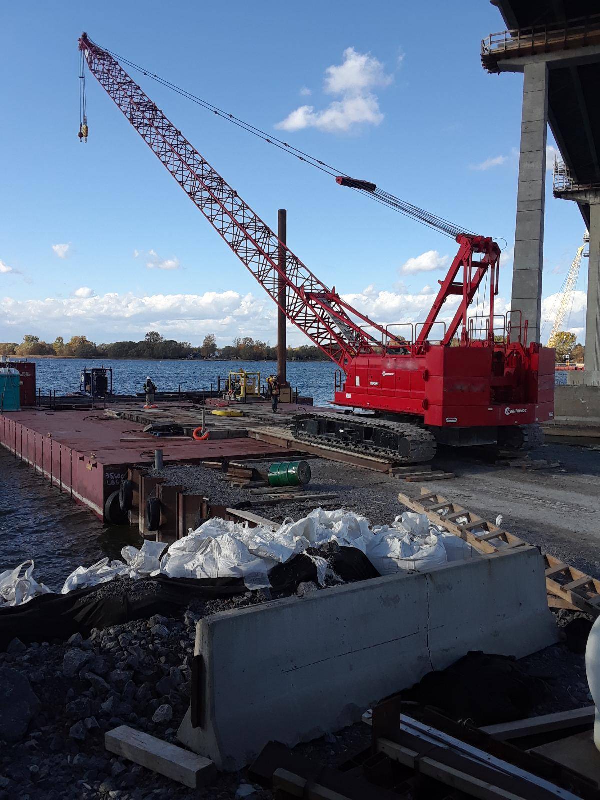 Loading the 110 ton crane onto the barge