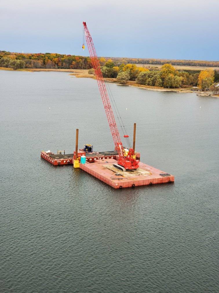 110 ton crane and rebar on the barge awaiting installation