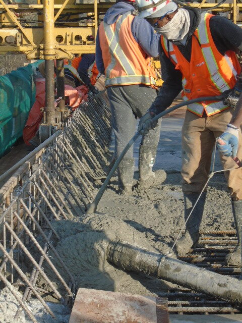 Pumping and vibrating concrete into formwork