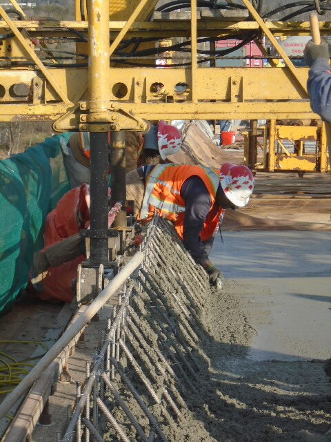 Smoothing the edges of the newly placed concrete
