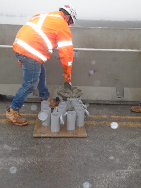 Filling the test cylinders with concrete