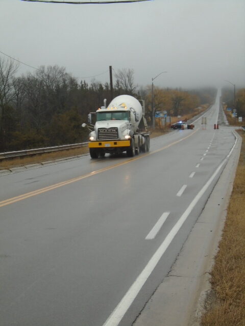 Concrete truck going to the bridge deck for closure strip placement