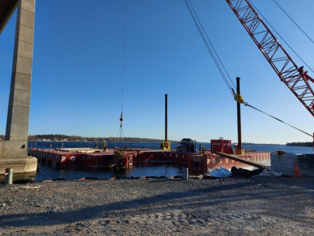 Using the 110 ton crane to adjust the barge section