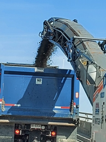 Removed asphalt being loaded into the truck