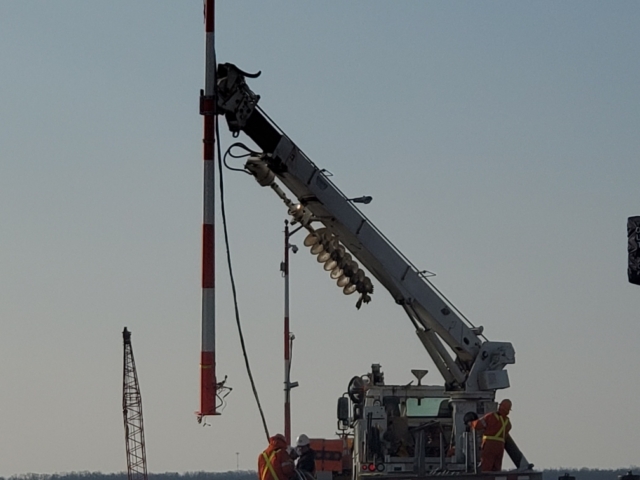 Removing temporary traffic signal poles for relocation