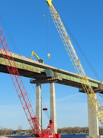 200 ton crane lowering the containment in to the barge