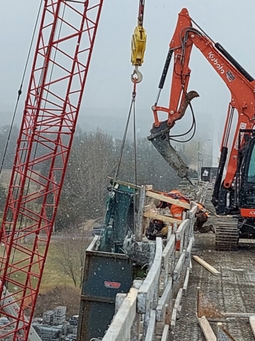 Demolition of the overhang / containment screens and bin