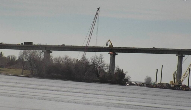 Expanded view of demolition , crushing of barrier wall, 200 ton crane