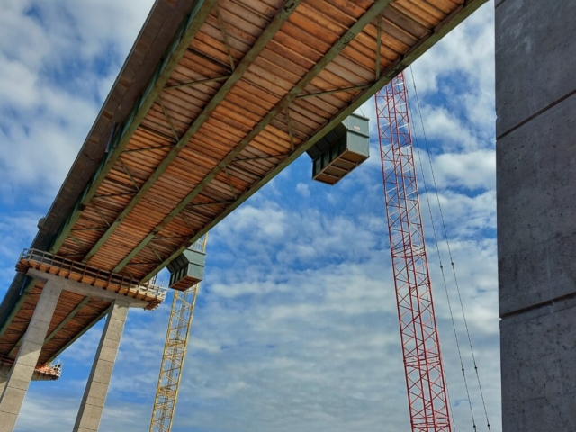 Containment bins used for demolition, view from below the bridge