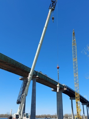 160 ton hydraulic crane lifting the buoy's to the boat for placement in the bay