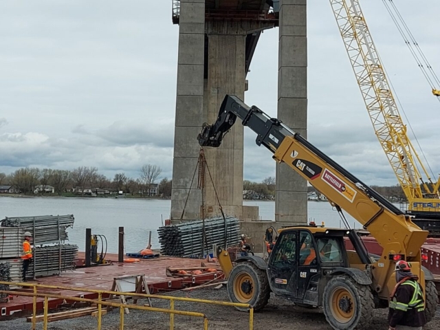 Loading scaffolding parts onto the barge to be installed on pier 5