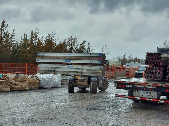 Containment scaffolding being loadfed on the truck for removal from site