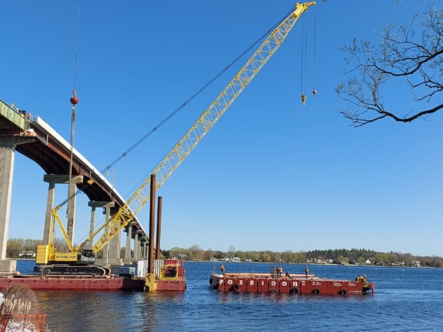 The barge taking the spreader bar and Iron Workers to the crane barge for girder removal