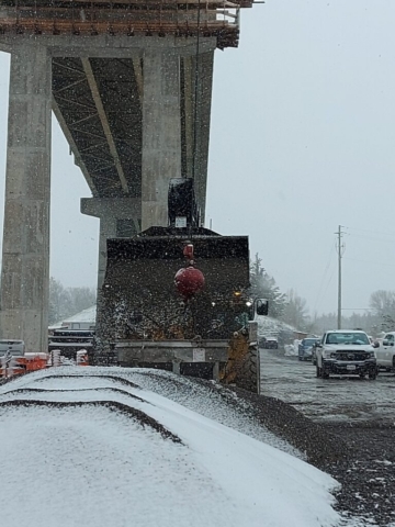 Telehandler loading the hopper with granular