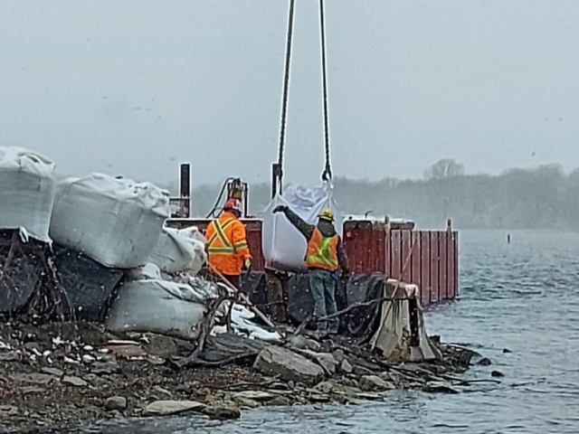 Lowering the meter bags into place for the dock expansion