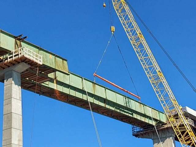 Starting to torch cut the girder piece for removal