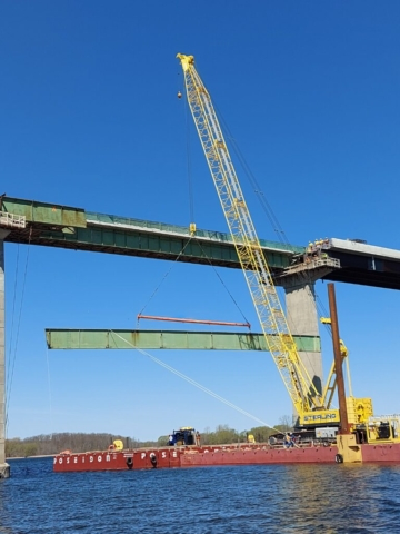 Approach girder section mid-lift