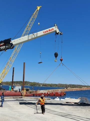 Moving the cut girder section to the site from the barge