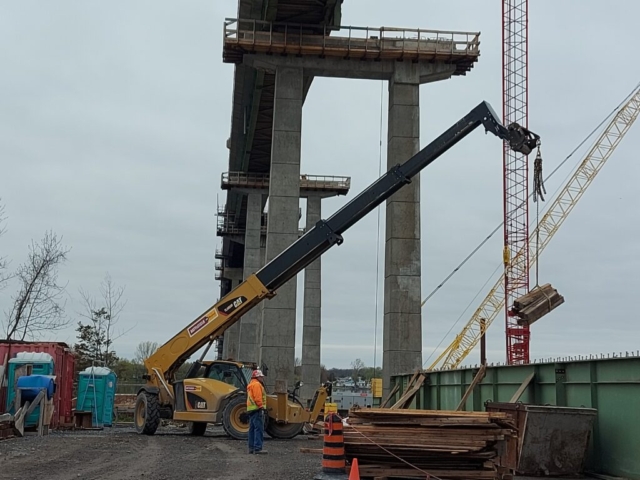 Telehandler removing the false decking from removed girder