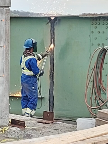 Torch cutting the removed girders