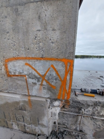 Concrete chipping on pier 6 in preparation for concrete patches