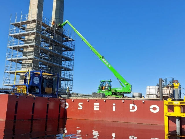 Man lift being used to lift materials for scaffolding build