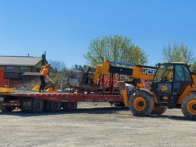 Unloading the truck of equipment for girder installation