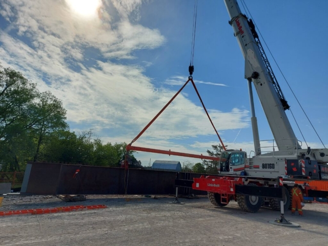 160 ton crane hooked up to the first piece of the second approach girder section