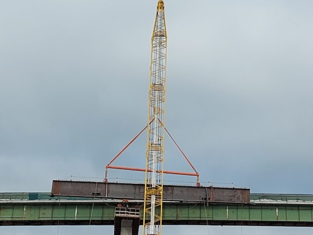 Lowering the first haunch piece onto pier cap 12