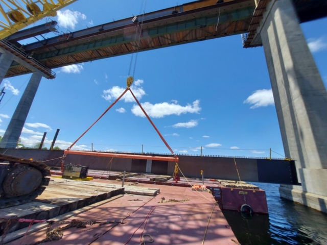 Pier 12 haunch girder and first approach girder installed, second approach girder on the barge for installation