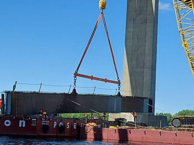 Starting to lift the second approach girder piece