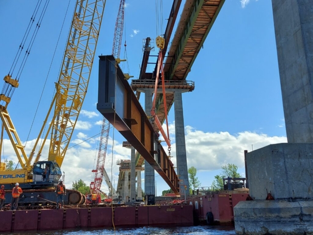 Sideview of the approach girder being lifted