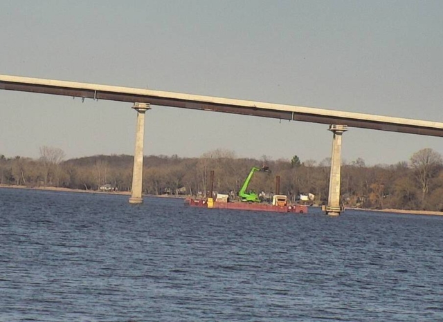 Manlift on the barge being used to remove deck formwork