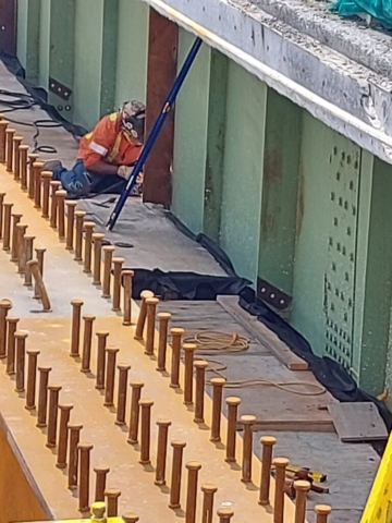 Welding the vertical stiffener on the existing girder