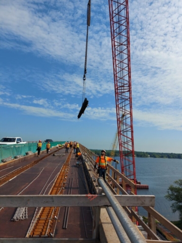 110 ton crane lifting rebar to the deck for installation