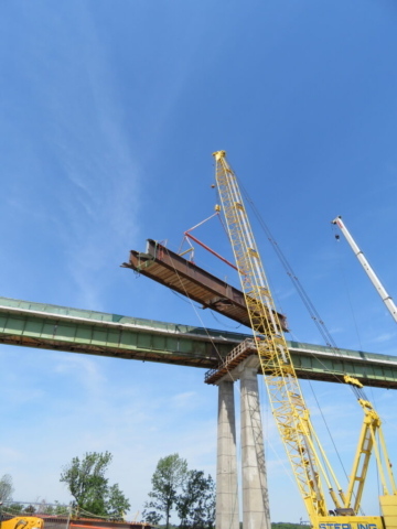 Moving the haunch girder into place over pier cap 13